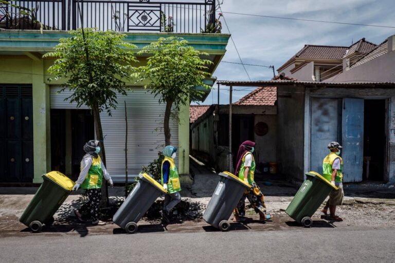 Waste collection workers during the Project STOP programme in coastal Indonesia